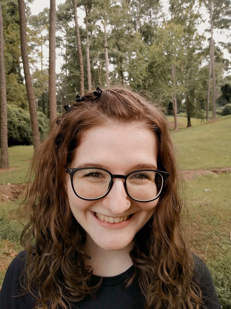 Allison stood in front of trees