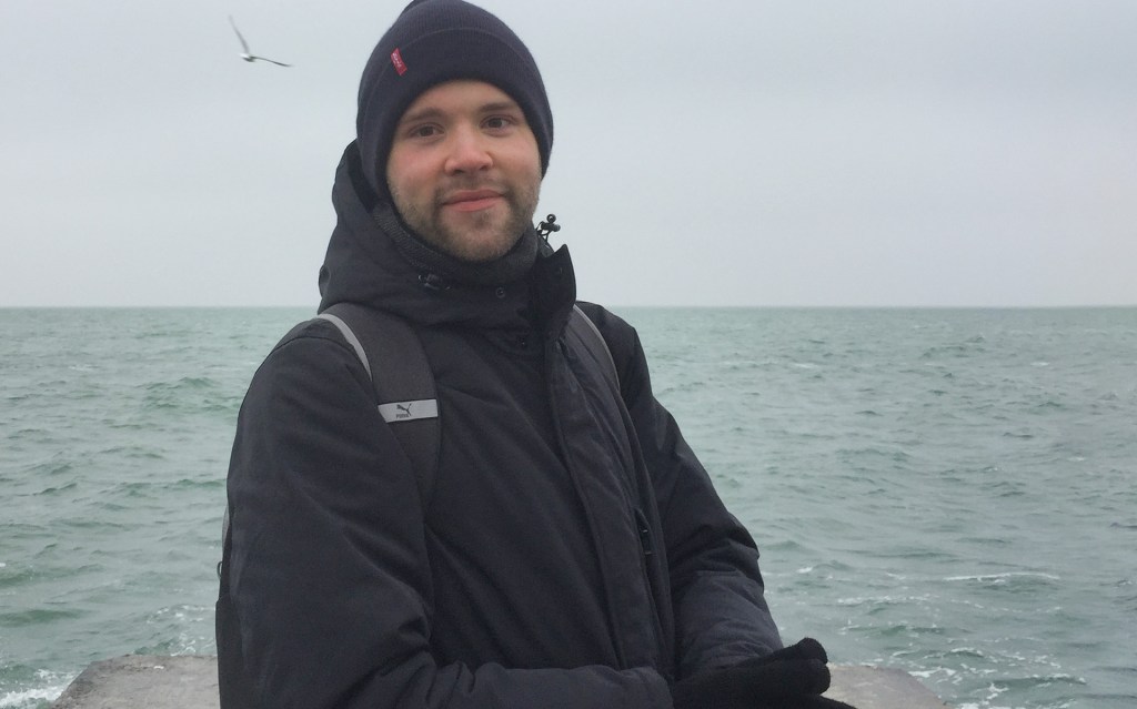 Artemy standing on the pier